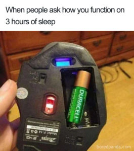 A picture of a battery in a gaming mouse that is installed incorrectly in a space meant for 2 batteries. The caption reads: "When people ask how you function on 2 hours of sleep"