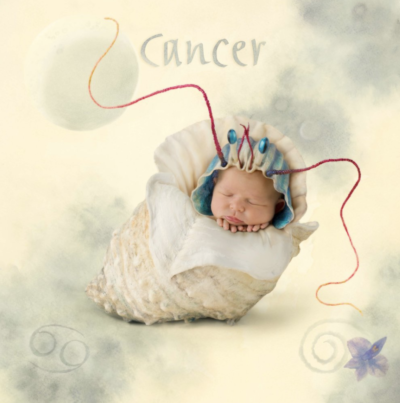 anne geddes photo of a baby dressed as a crab representing the astrological sign cancer