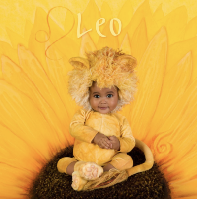 anne geddes photo of a baby dressed as a lion representing the astrological sign leo