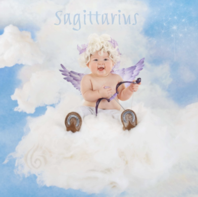 anne geddes photo of a baby dressed as an angel representing the astrological sign sagittarius