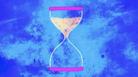 a gif of an hourglass spinning