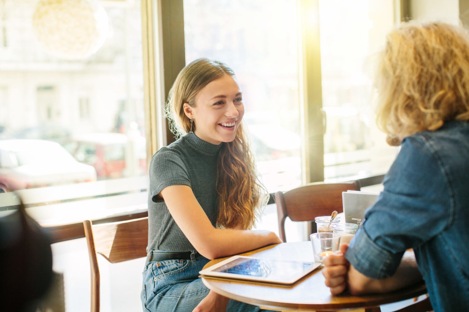 Young woman interviews for a job at a cafe
