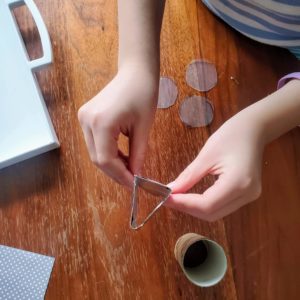 DIY Kaleidoscope: glue along the edge of your foil/cardboard to make a triangle