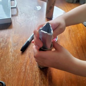 DIY Kaleidoscope:Insert the cardboard triangle into your tube