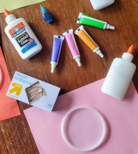 Supplies to make a glue suncatcher.